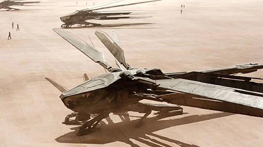 Ornithopter flying over vast desert landscape