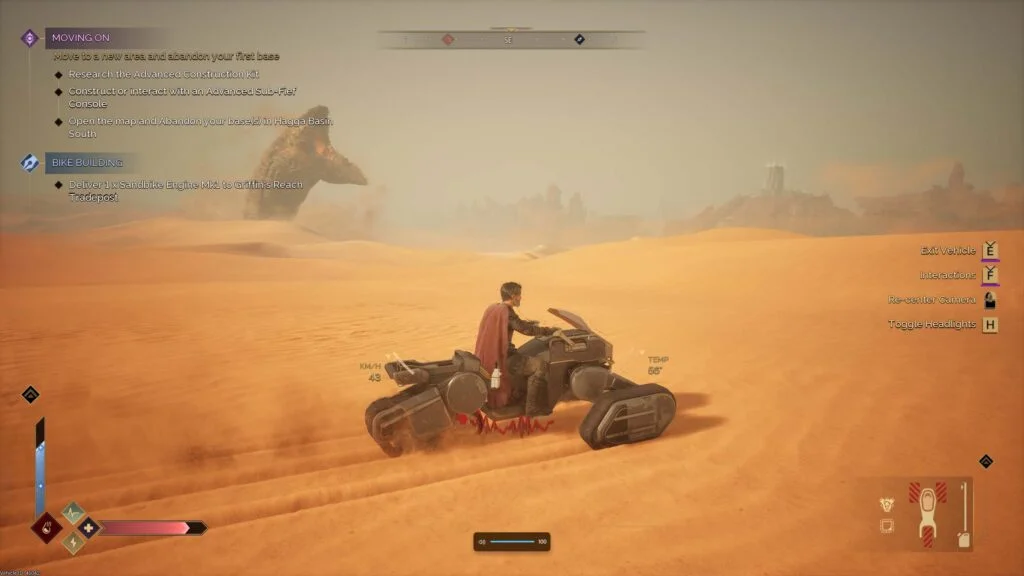 Player riding a sandbike across the desert sands in Dune Awakening
